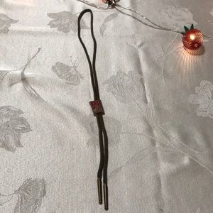 Bolo String Bird Hunter Sitting on Log with Shotgun Vintage